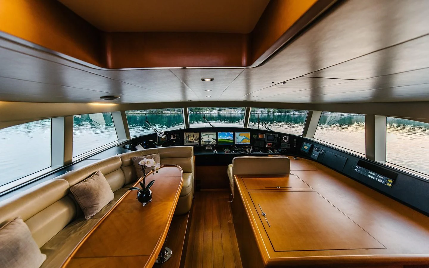 a room with a couch and a table and a window aboard CARPE DIEM Yacht for Sale