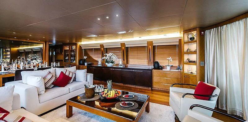 a living room with a white couch and a table aboard CARPE DIEM Yacht for Sale