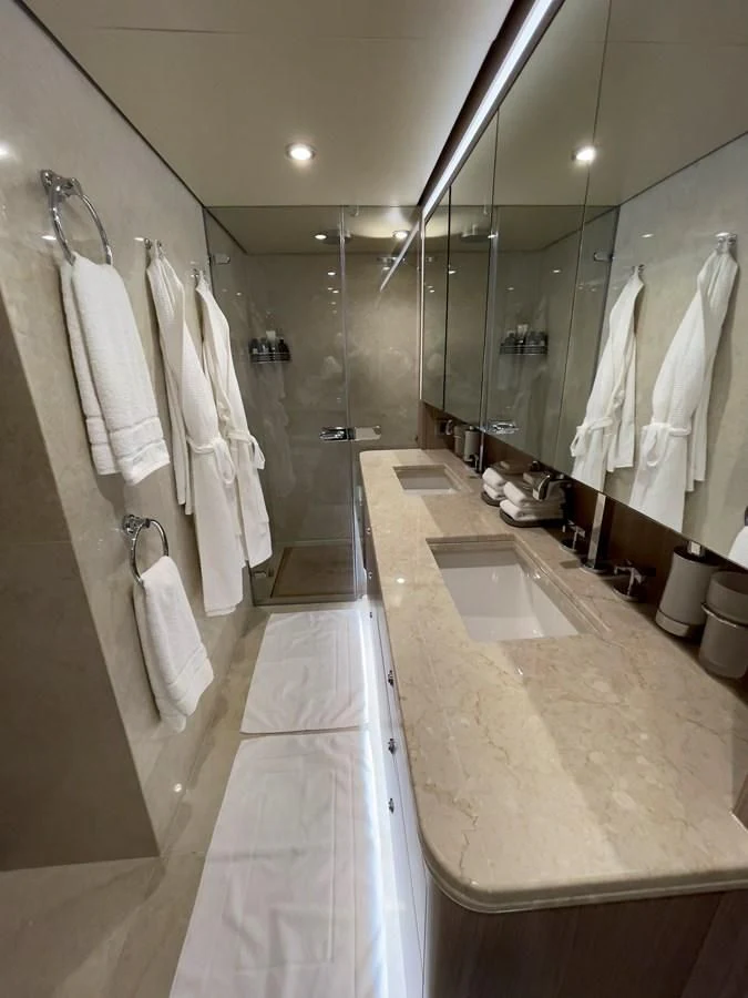 a bathroom with a large mirror aboard CARPE DIEM Yacht for Sale