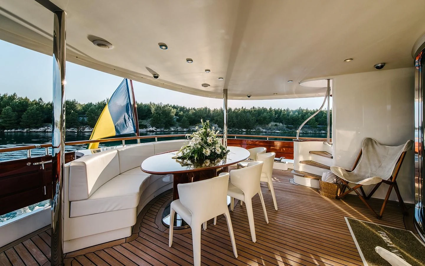 a table and chairs on a deck aboard CARPE DIEM Yacht for Sale