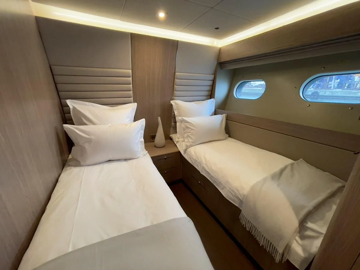 a couple of beds in a room aboard CARPE DIEM Yacht for Sale