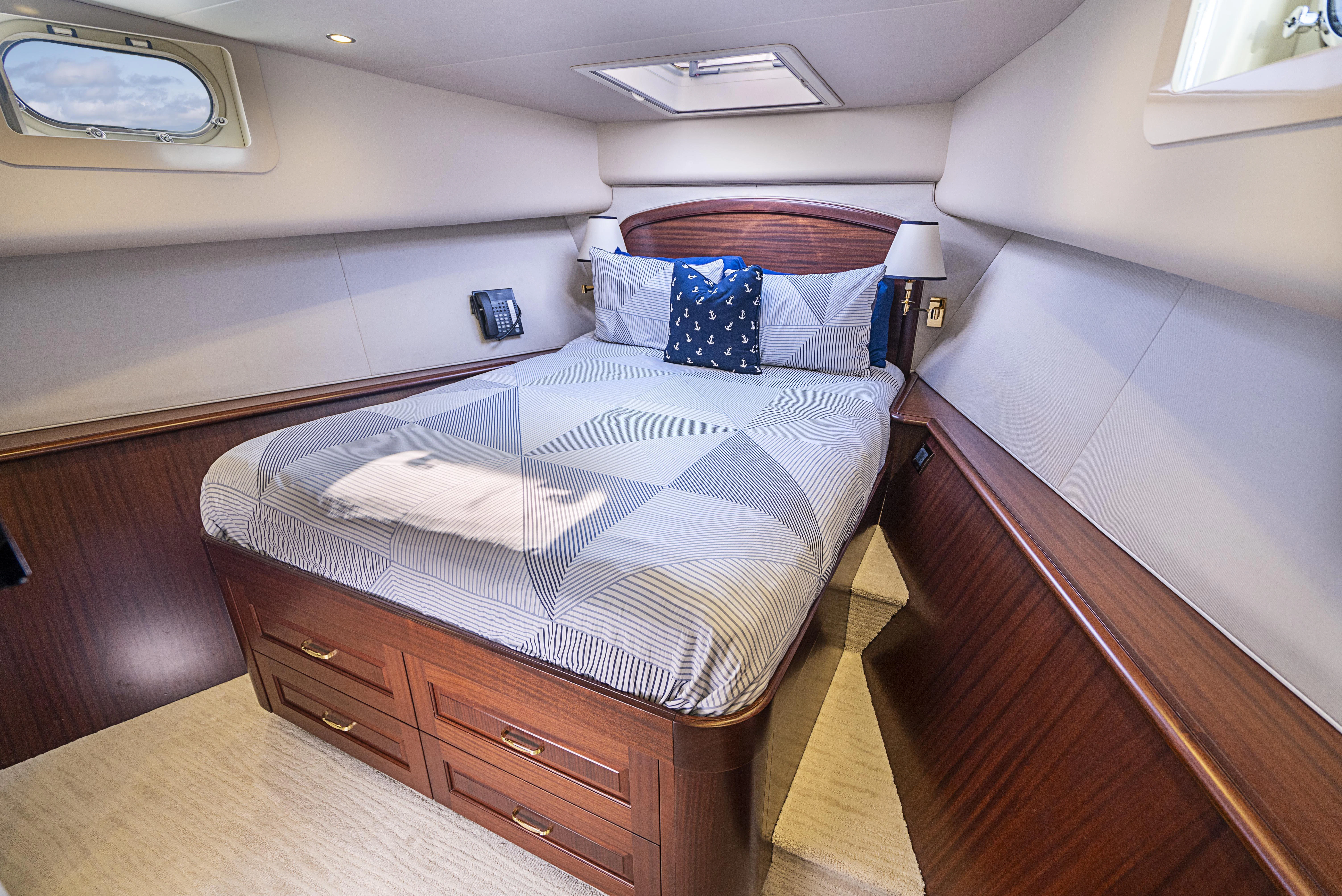 a bed in a room aboard CARPE DIEM Yacht for Sale