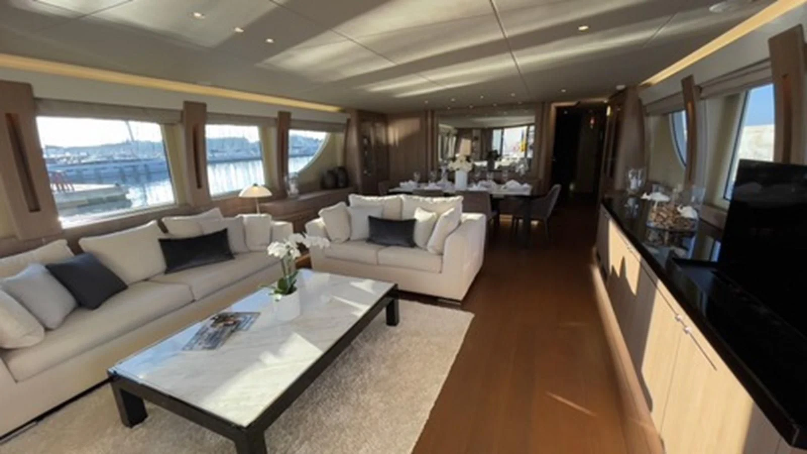 a living room with a large window aboard CARPE DIEM Yacht for Sale