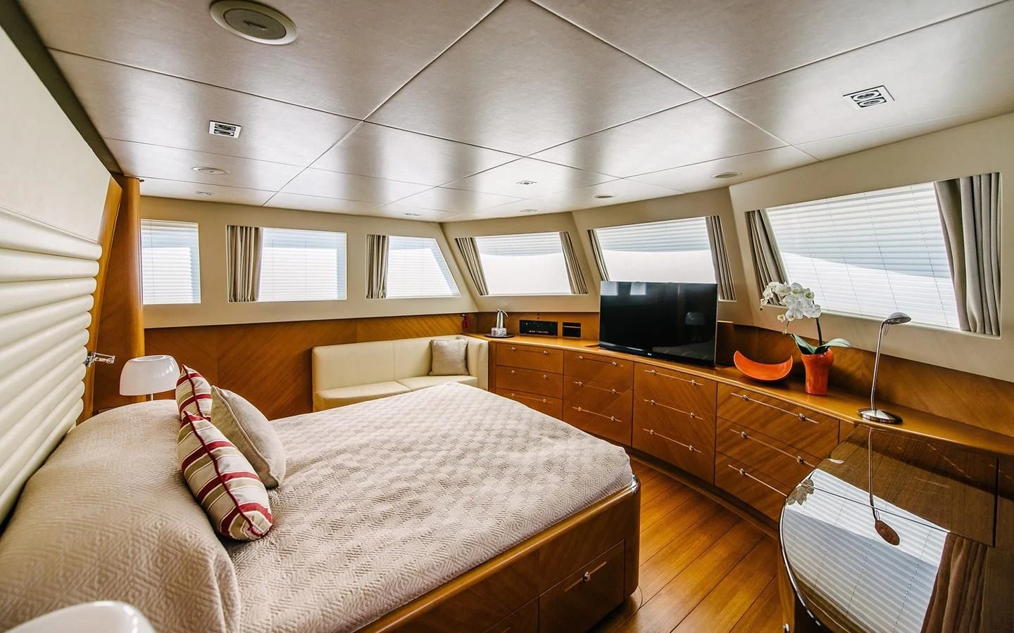 a bedroom with a bed and a tv aboard CARPE DIEM Yacht for Sale