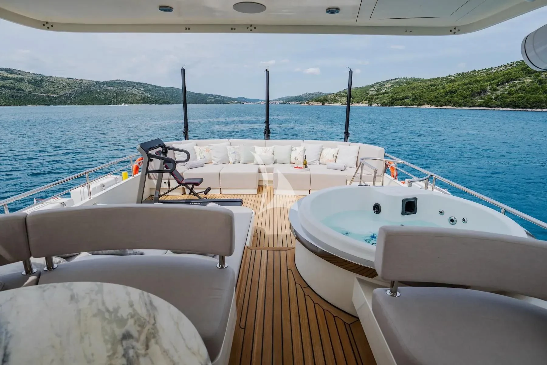 a deck with chairs and a table on it aboard CARPE DIEM Yacht for Sale