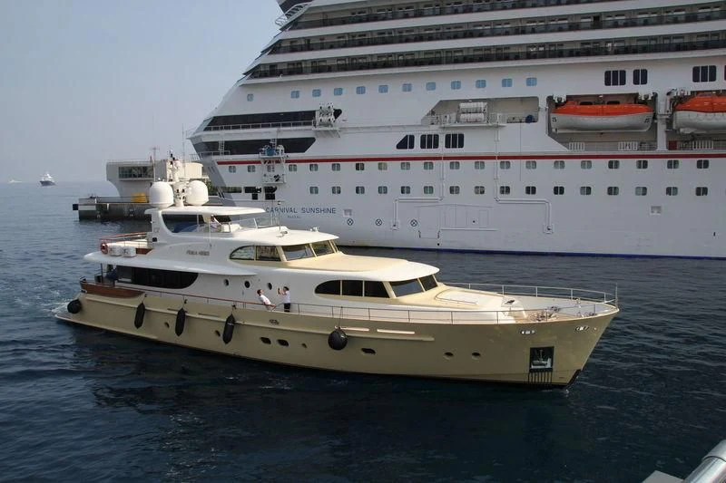 a large white ship in the water aboard CARPE DIEM Yacht for Sale