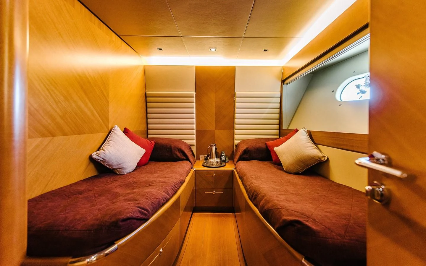 a room with a bed and a couch aboard CARPE DIEM Yacht for Sale