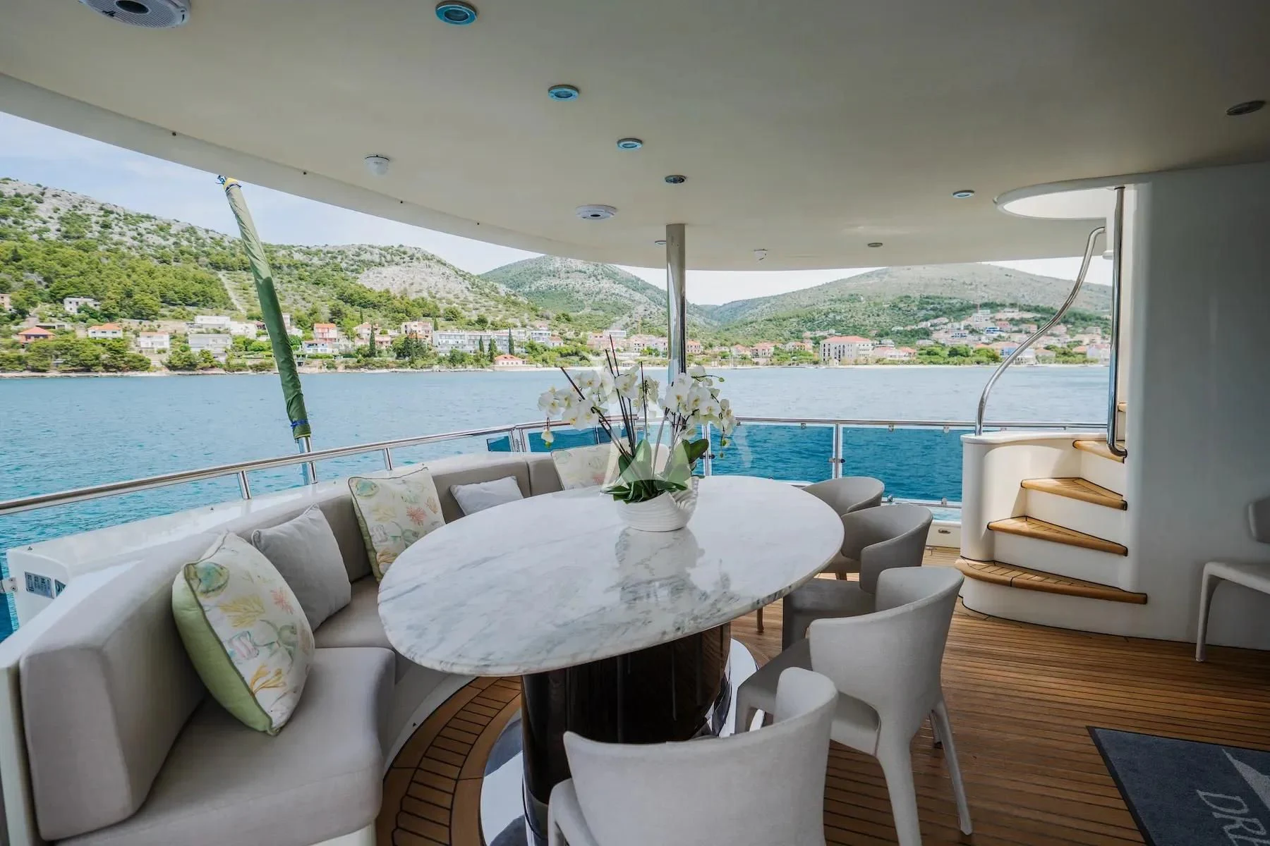 a room with a table and chairs aboard CARPE DIEM Yacht for Sale
