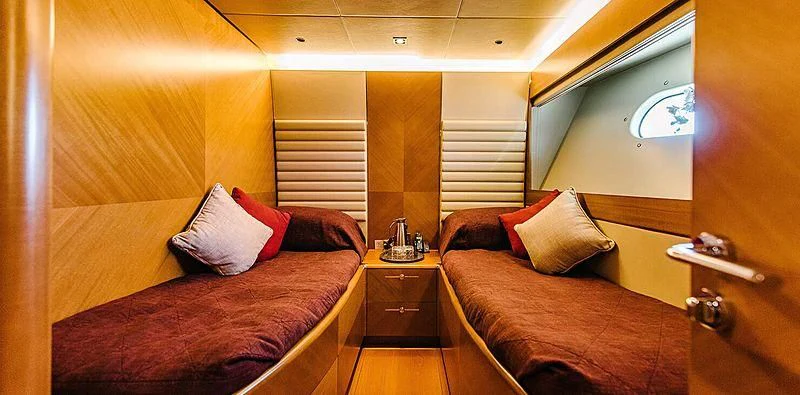 a room with two beds aboard CARPE DIEM Yacht for Sale