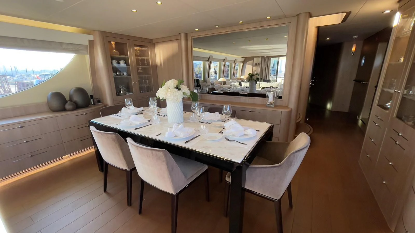 a large kitchen with a dining table aboard CARPE DIEM Yacht for Sale