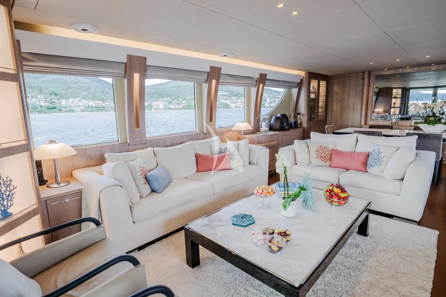 a living room with a couch and a table aboard CARPE DIEM Yacht for Sale