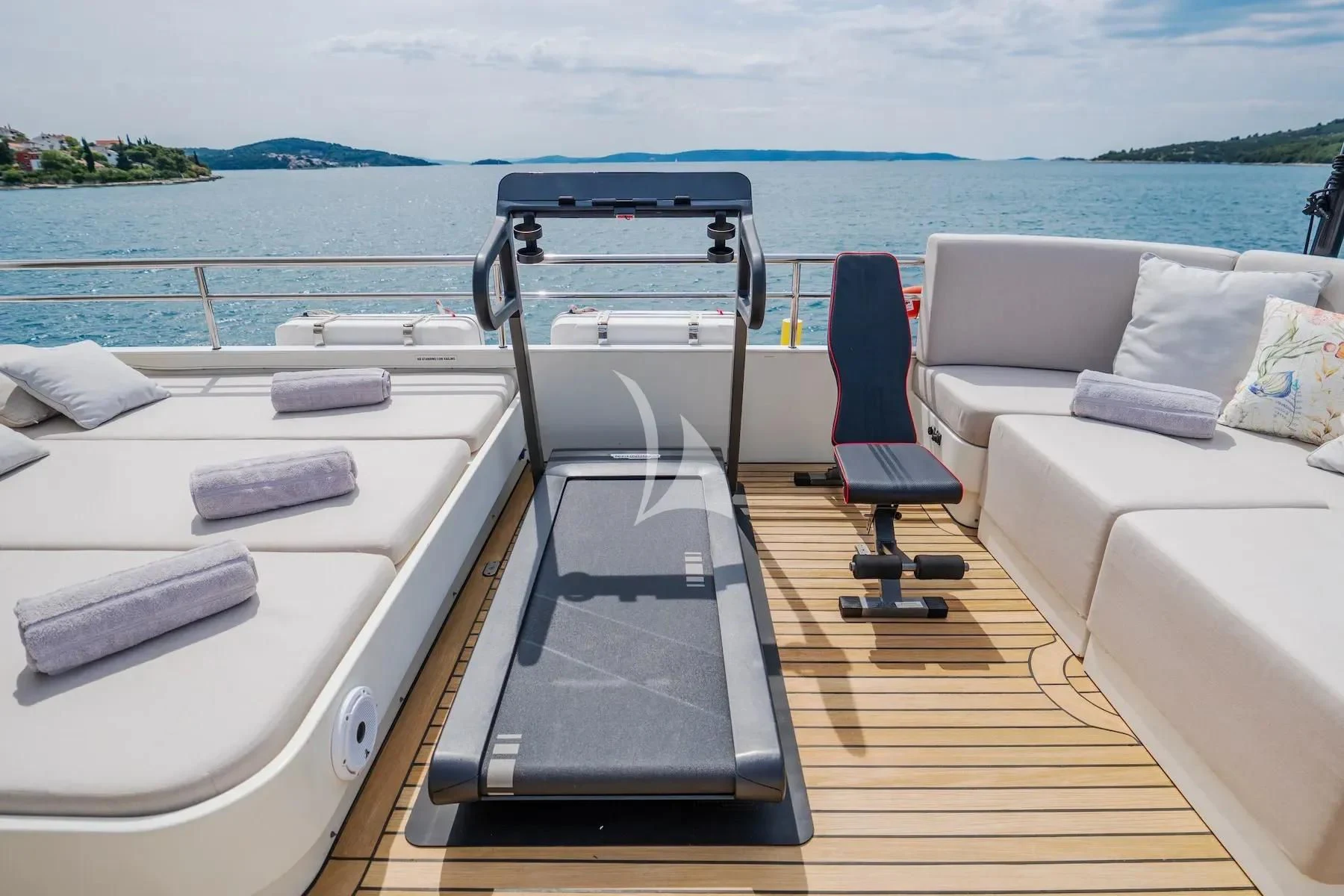 a deck with a chair and a bed on it aboard CARPE DIEM Yacht for Sale