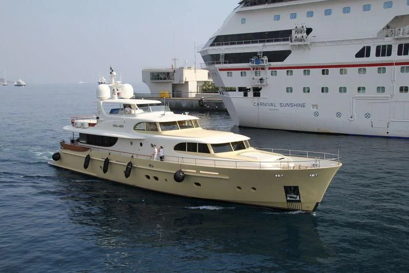 a couple of large white boats in the water aboard CARPE DIEM Yacht for Sale