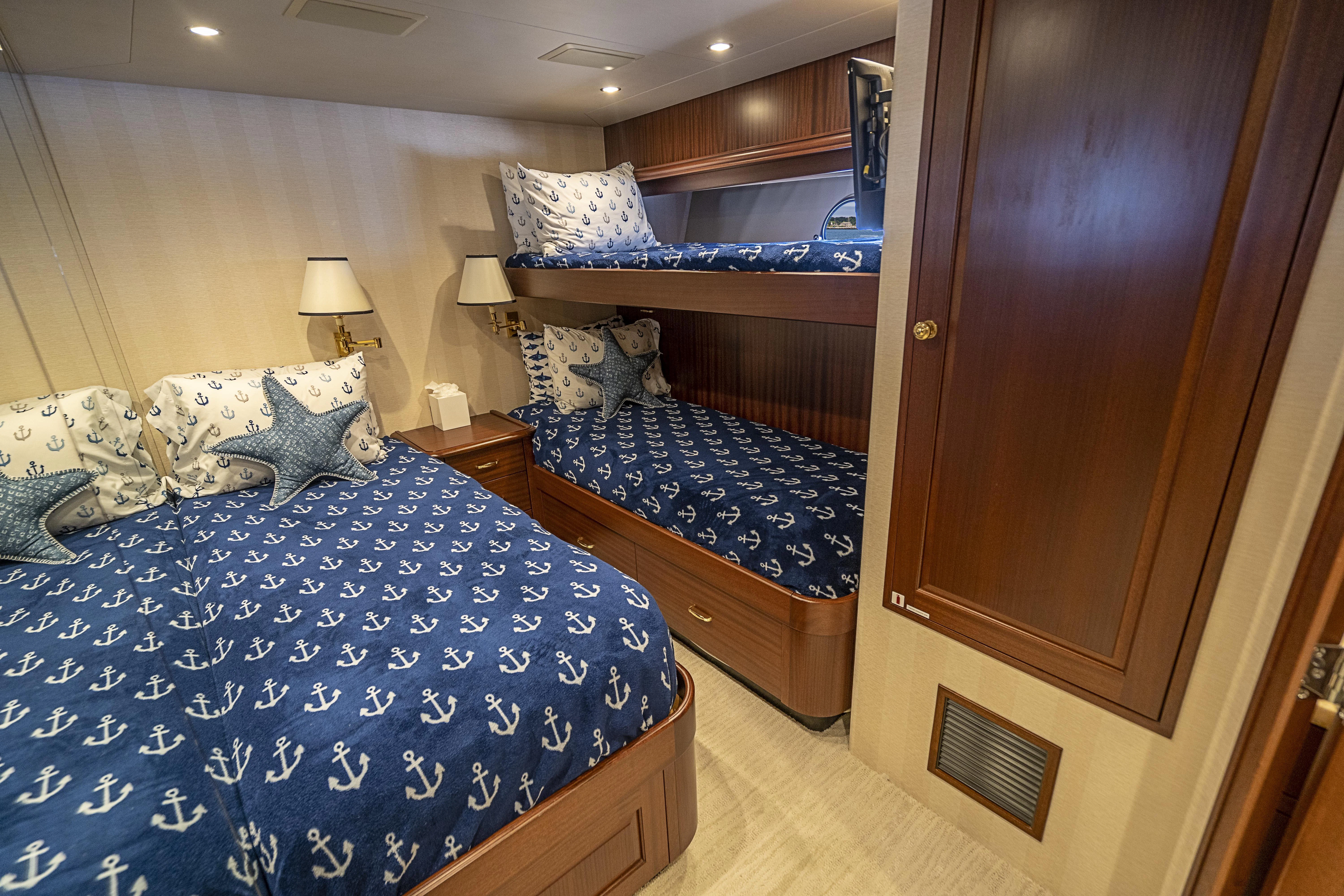 a couple of beds in a hotel room aboard CARPE DIEM Yacht for Sale