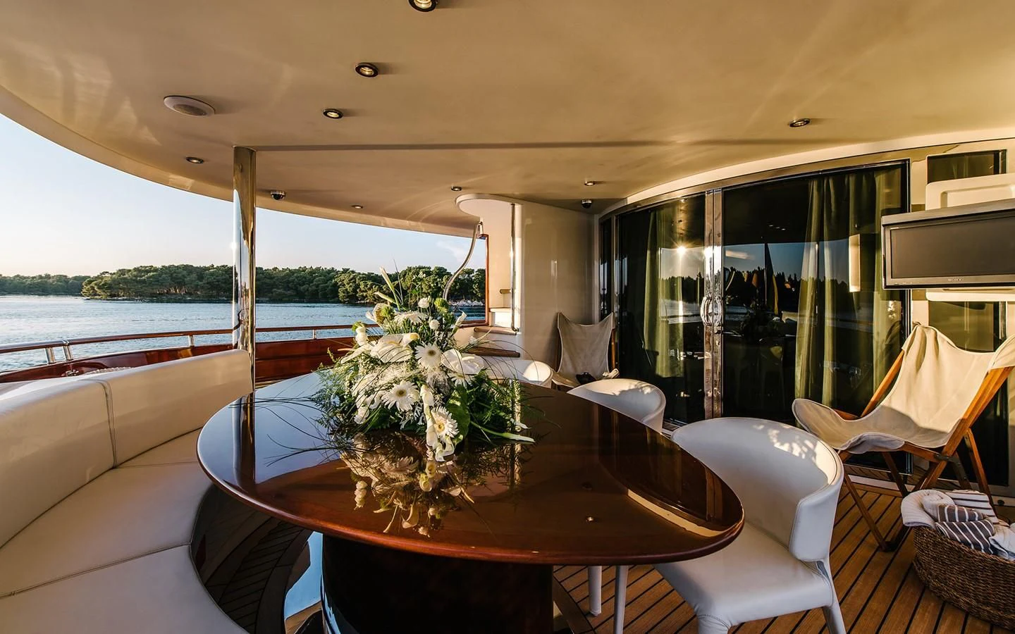a table with a plant on it aboard CARPE DIEM Yacht for Sale
