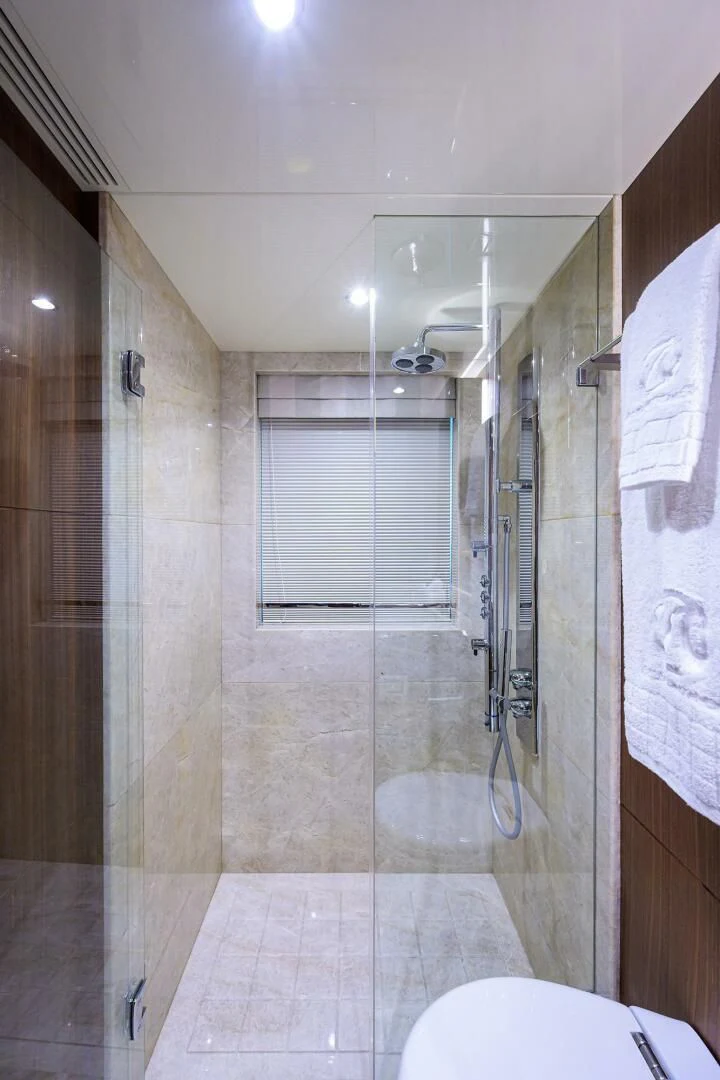 a bathroom with a shower unit and a toilet aboard ZEPHYR Yacht for Charter
