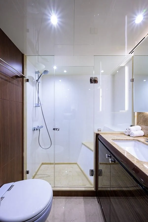 a bathroom with a shower and sink aboard ZEPHYR Yacht for Charter
