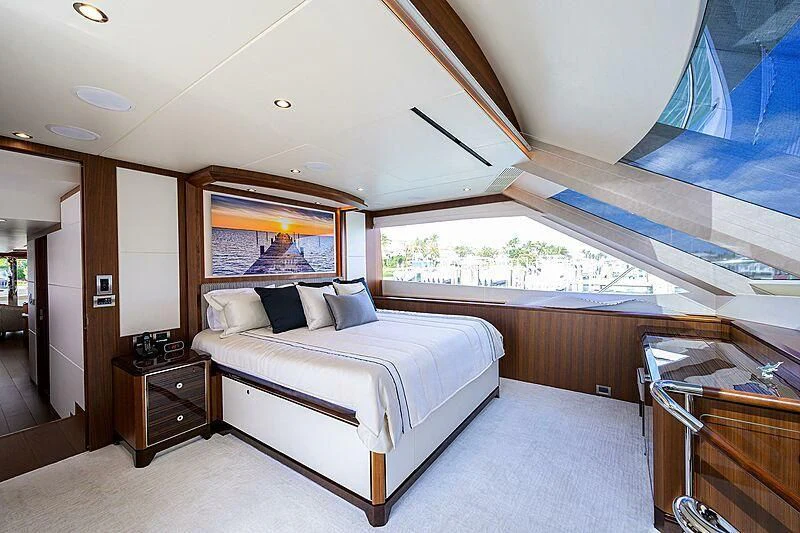 a bedroom with a large bed aboard ZEPHYR Yacht for Charter