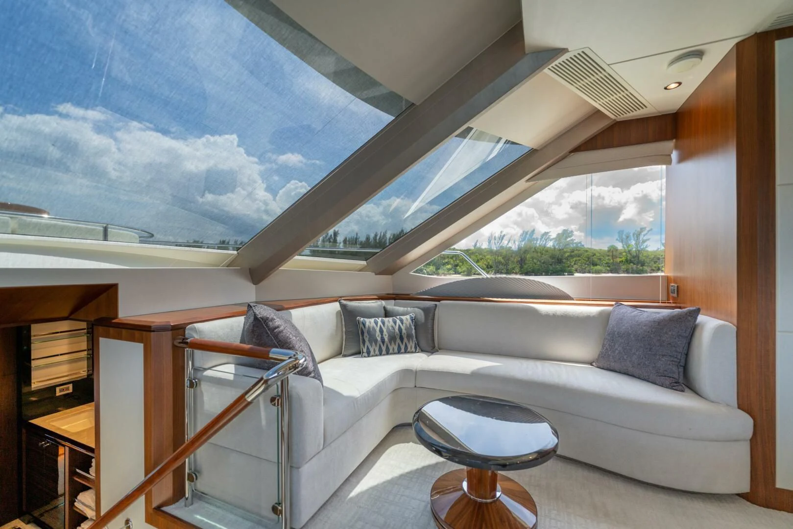 a room with a couch and a window aboard ZEPHYR Yacht for Charter