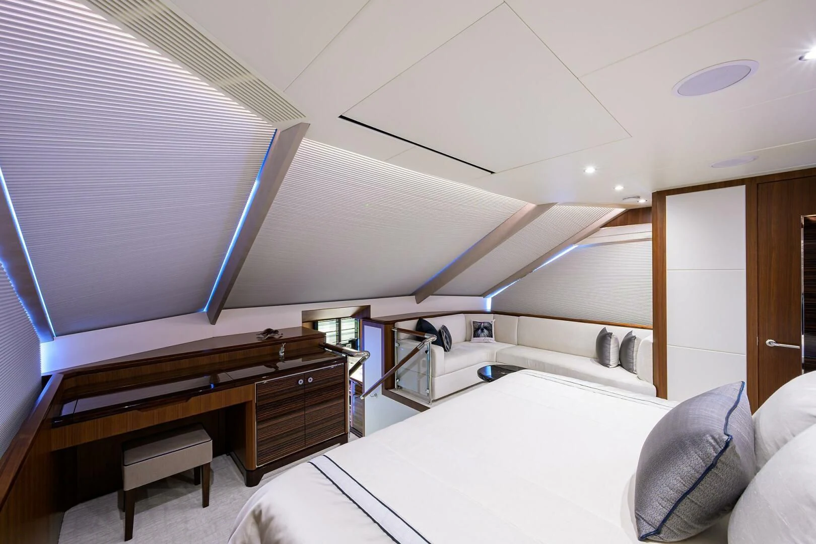 a room with a bed and a desk aboard ZEPHYR Yacht for Charter