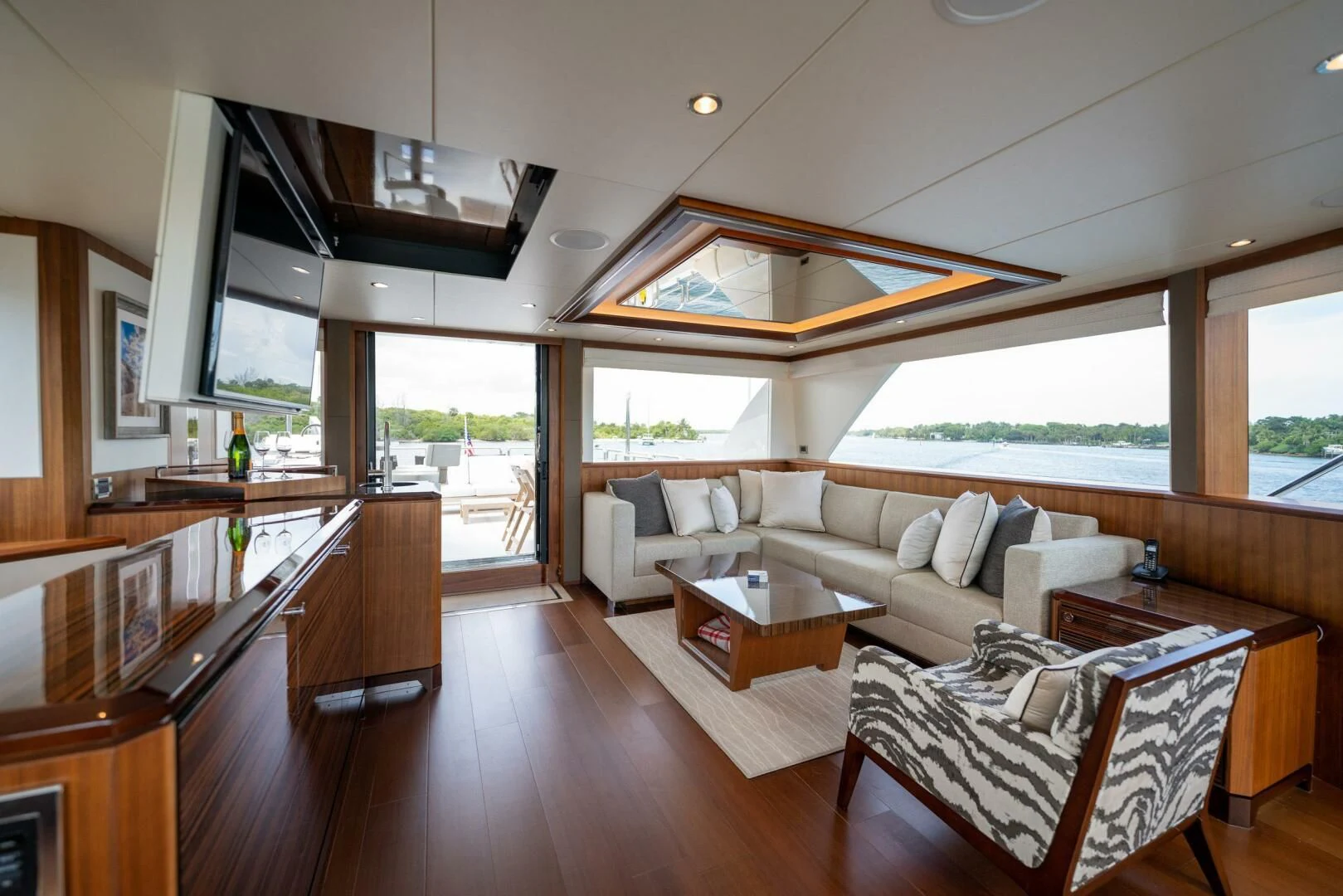 a living room with a large open window aboard ZEPHYR Yacht for Charter