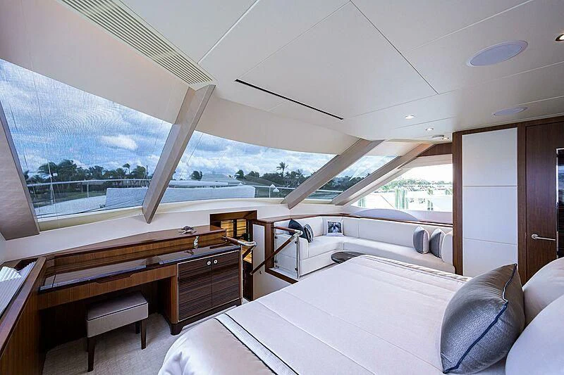 a room with a bed and a window aboard ZEPHYR Yacht for Charter