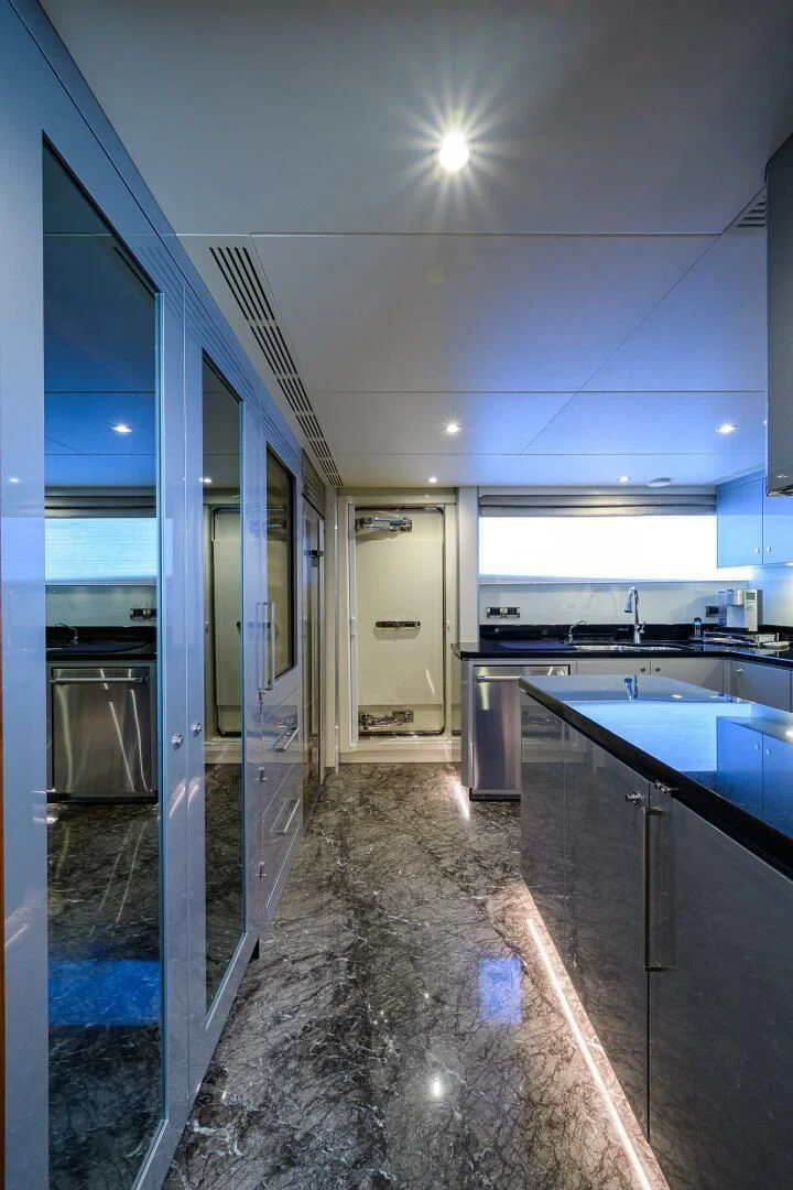 a kitchen with a large glass door aboard ZEPHYR Yacht for Charter