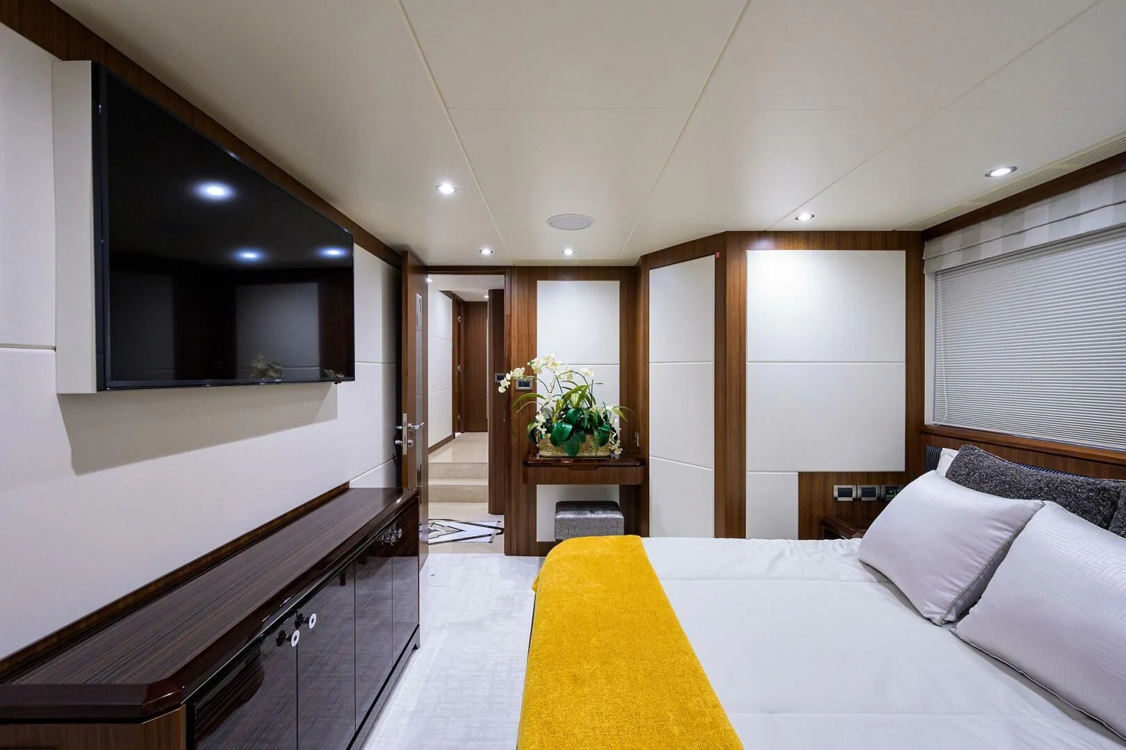 a bedroom with a large bed aboard ZEPHYR Yacht for Charter