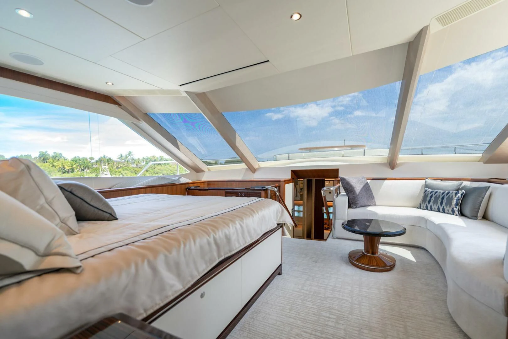 a room with a bed and a table aboard ZEPHYR Yacht for Charter
