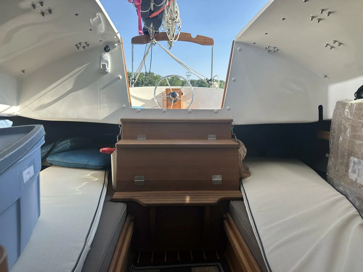 a room with a bed and a couple of suitcases aboard ZEPHYR Yacht for Charter