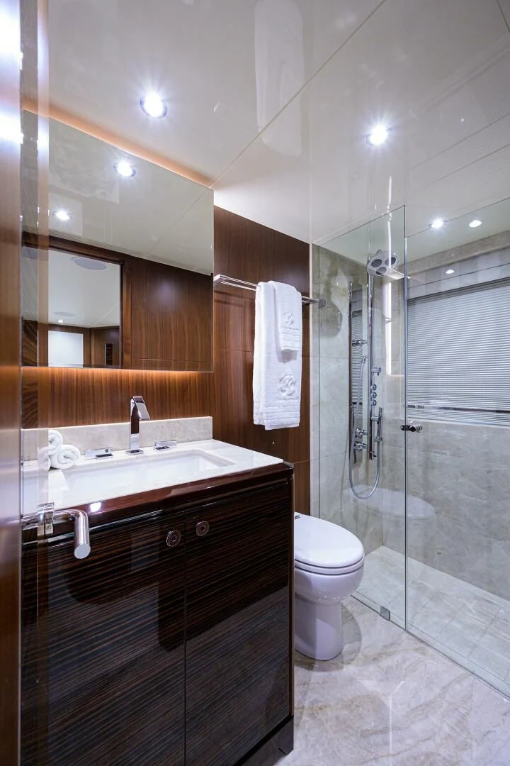 a bathroom with a glass shower aboard ZEPHYR Yacht for Charter