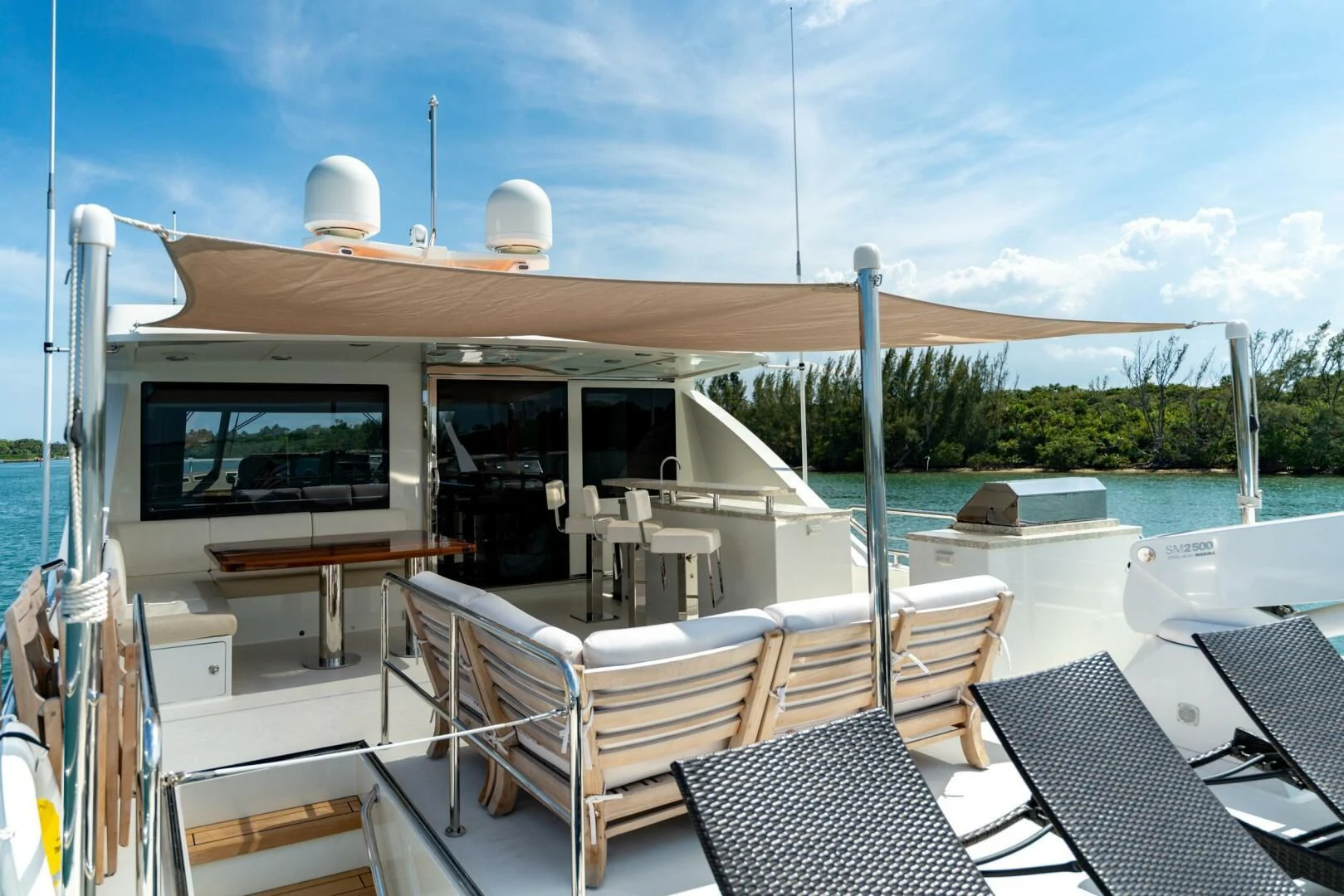 a deck with chairs and tables on it aboard ZEPHYR Yacht for Charter