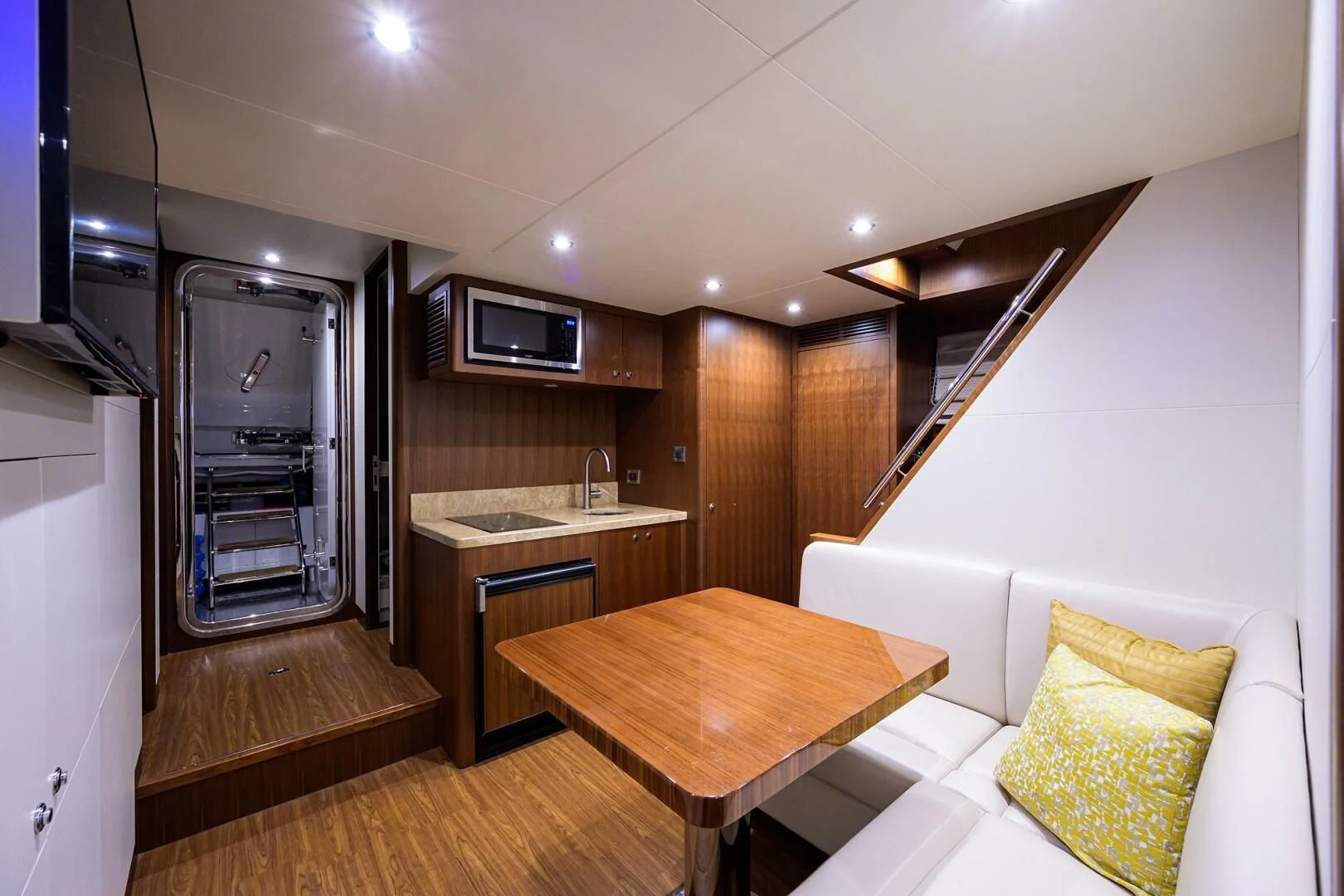 a room with a table and a couch aboard ZEPHYR Yacht for Charter