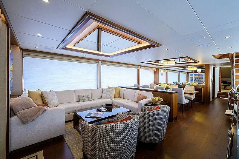 a living room with a large window aboard ZEPHYR Yacht for Charter