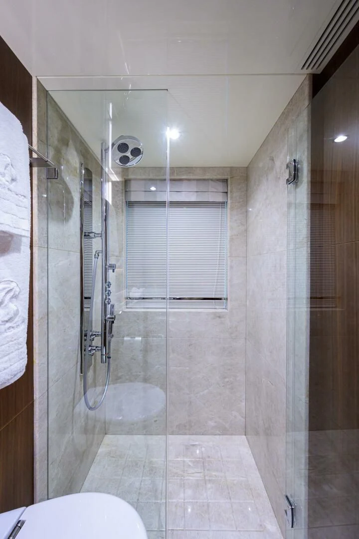 a bathroom with a shower unit aboard ZEPHYR Yacht for Charter