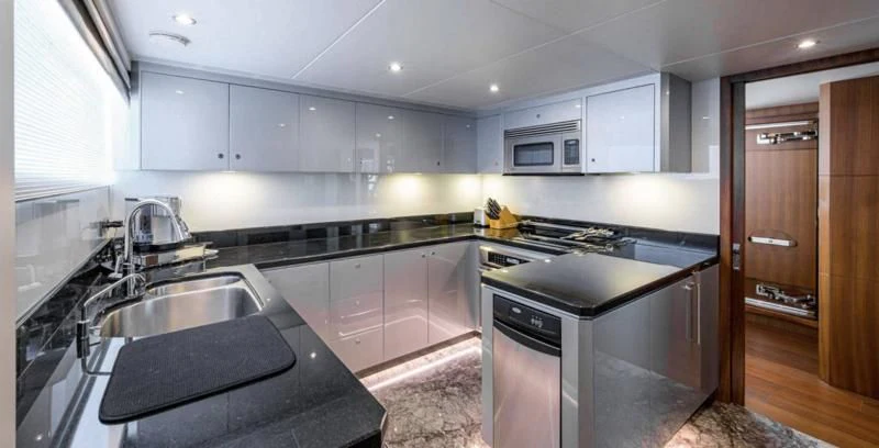 a kitchen with a sink and stove aboard ZEPHYR Yacht for Charter