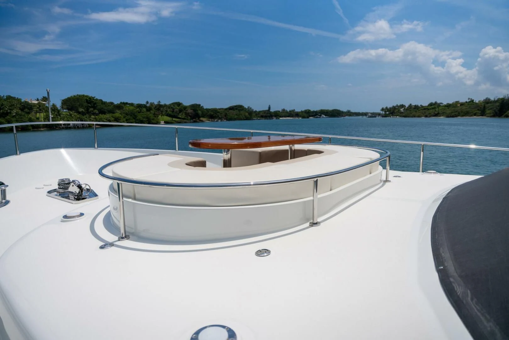 a white rectangular object on a white surface with a body of water in the background aboard ZEPHYR Yacht for Charter