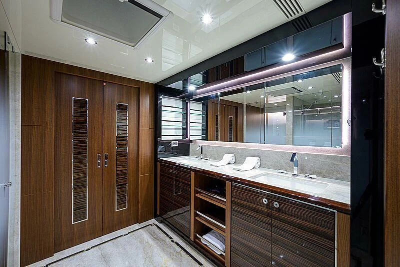 a bathroom with wooden cabinets aboard ZEPHYR Yacht for Charter