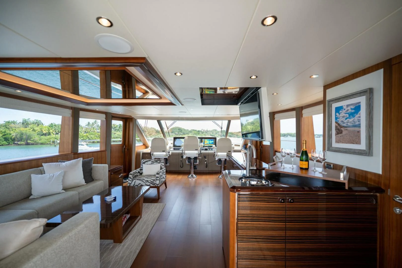 a living room with a large window aboard ZEPHYR Yacht for Charter