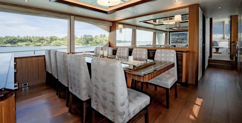 a dining table in a room aboard ZEPHYR Yacht for Charter