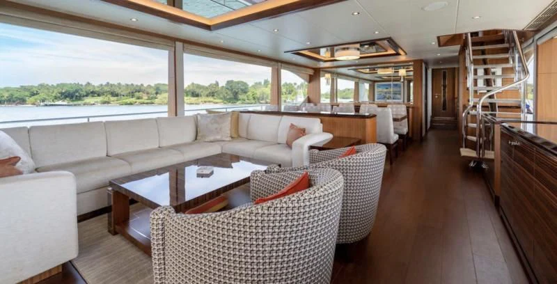 a living room with a large window aboard ZEPHYR Yacht for Charter