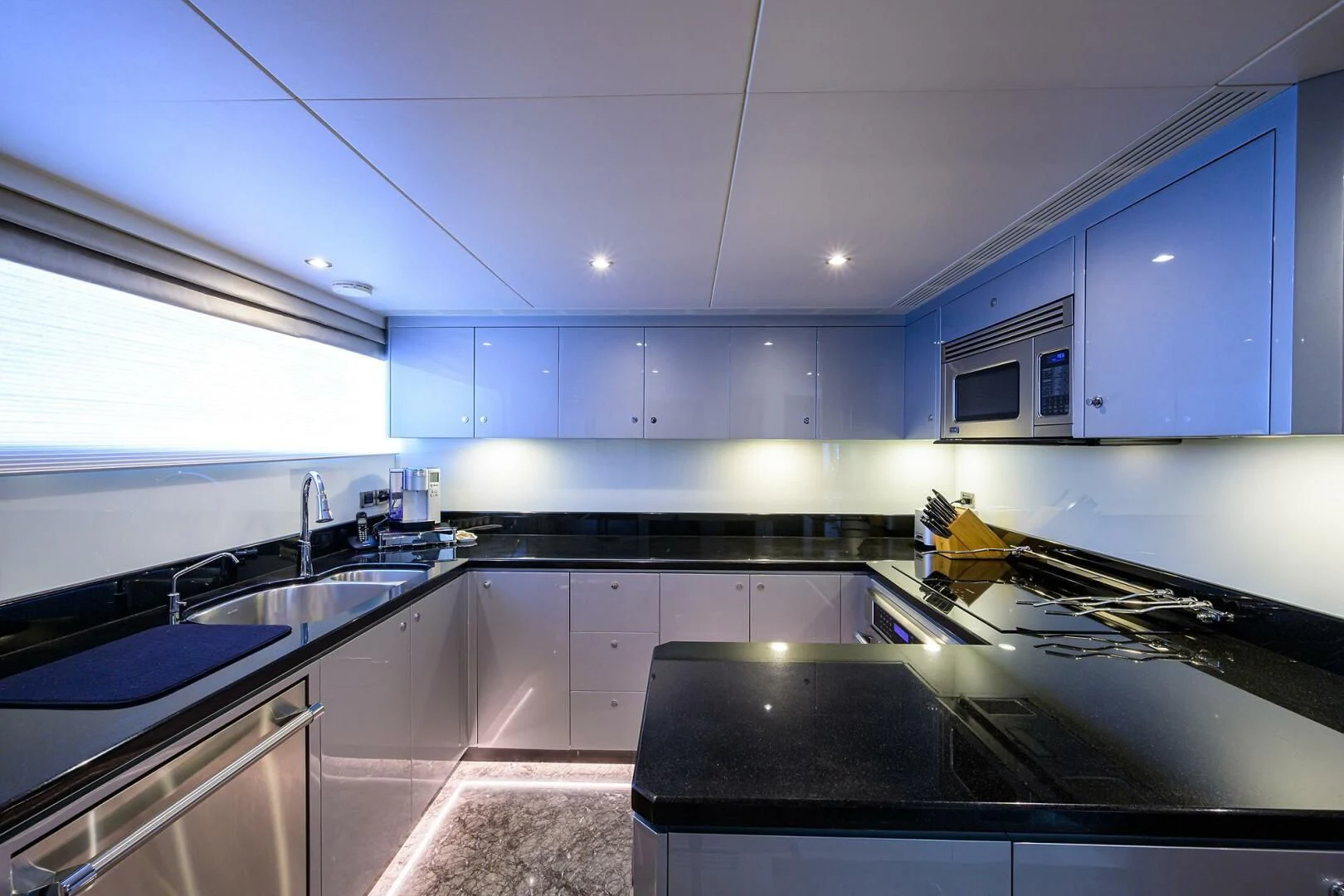 a kitchen with a sink and cabinets aboard ZEPHYR Yacht for Charter