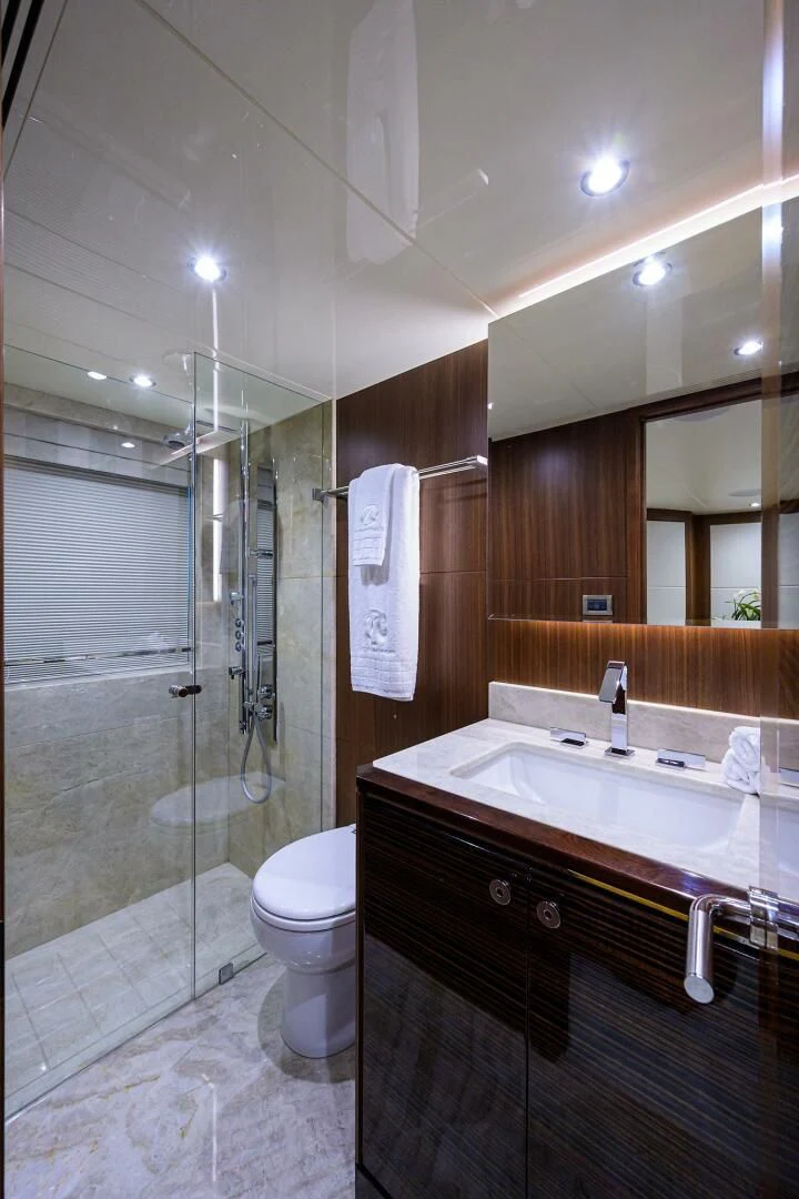 a bathroom with a glass shower aboard ZEPHYR Yacht for Charter