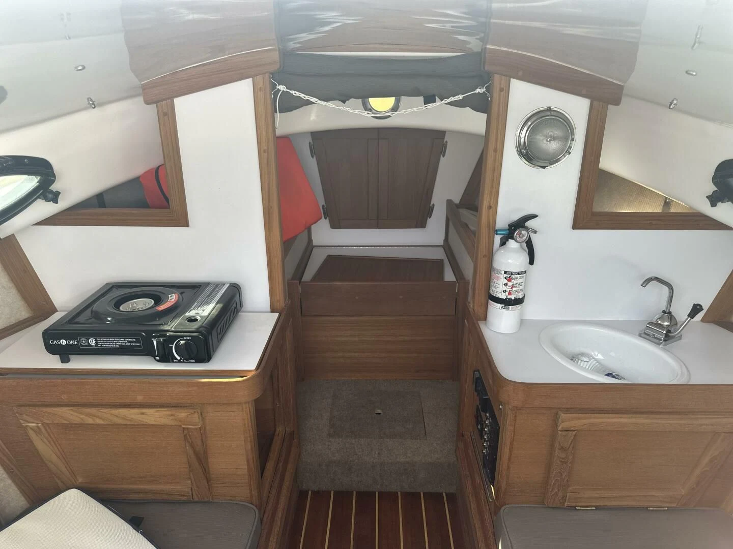 a small kitchen with a stove and sink aboard ZEPHYR Yacht for Charter