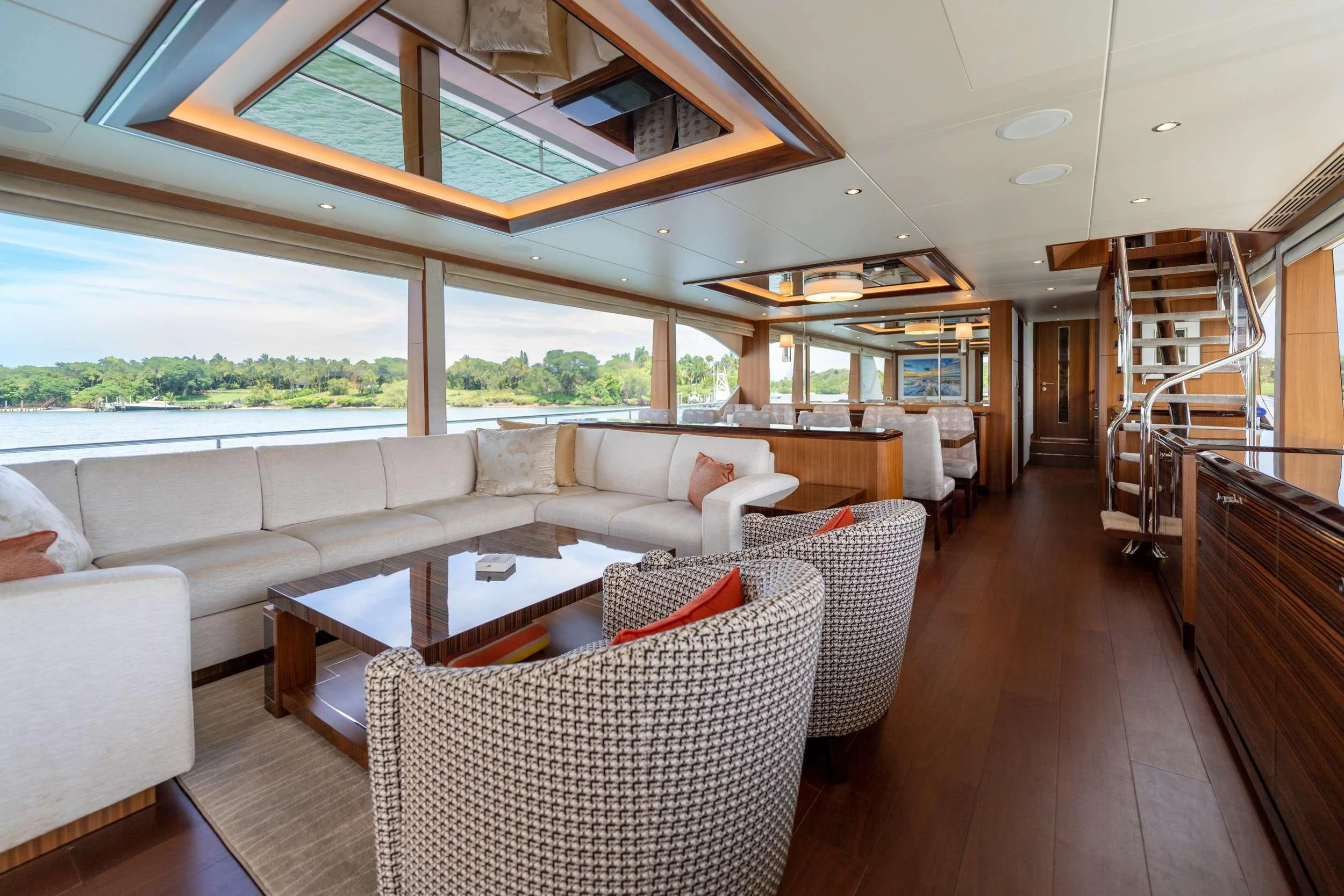 a living room with a large window aboard ZEPHYR Yacht for Charter