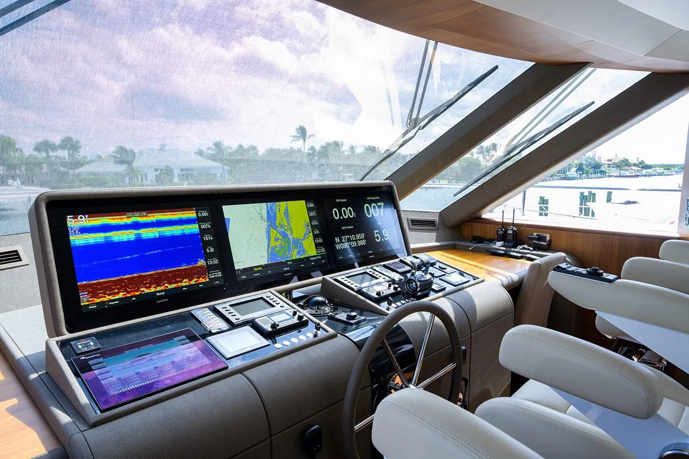 a room with many monitors and laptops aboard ZEPHYR Yacht for Charter