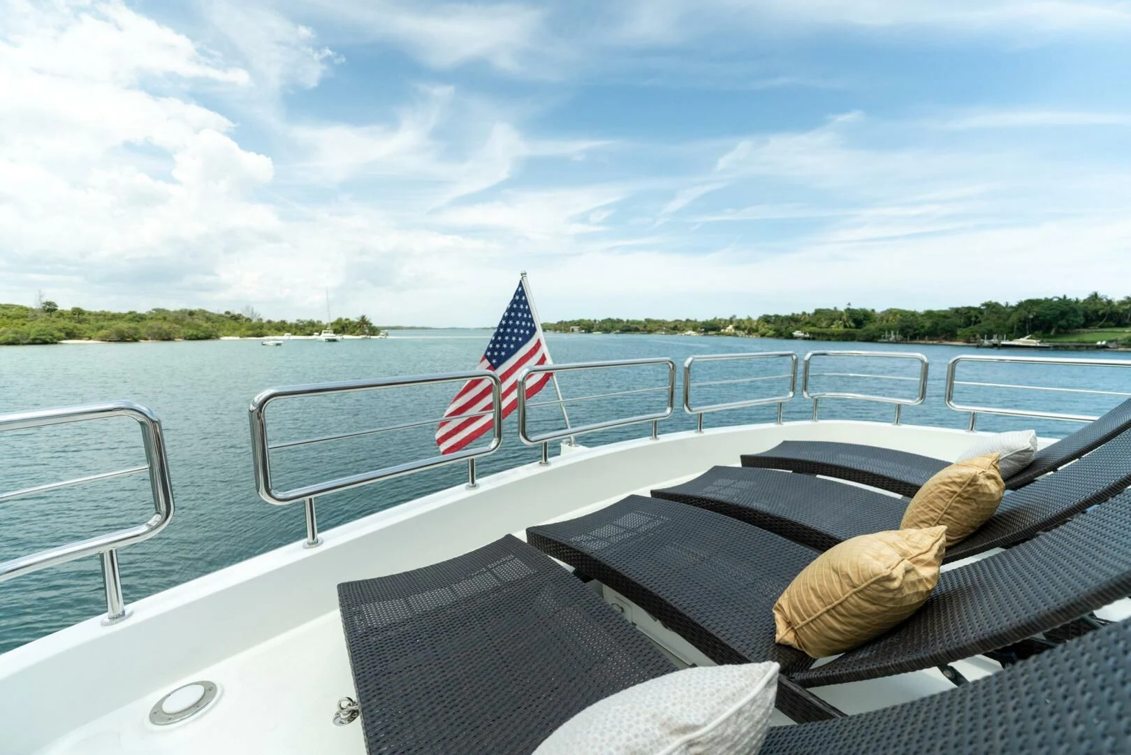 a boat with a flag on the deck aboard ZEPHYR Yacht for Charter