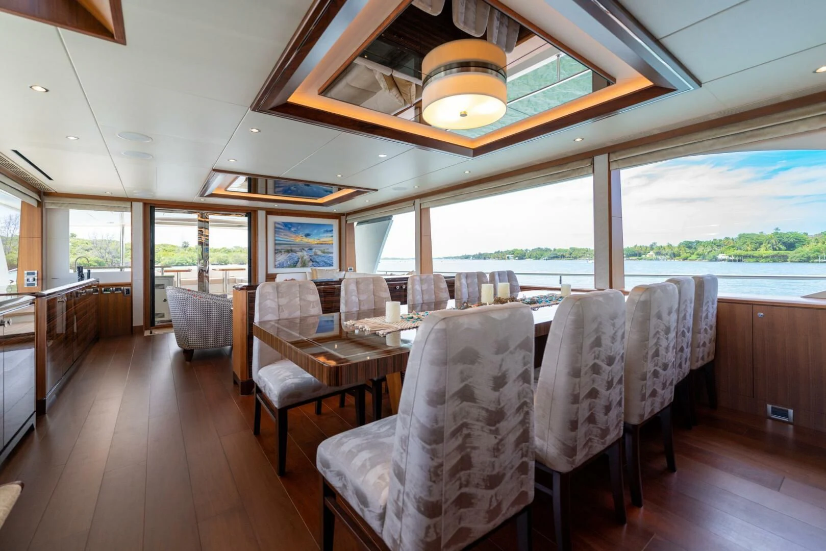 a dining room with a large window aboard ZEPHYR Yacht for Charter