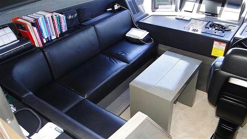 a leather couch in a room aboard PRATA DO LYS Yacht for Sale