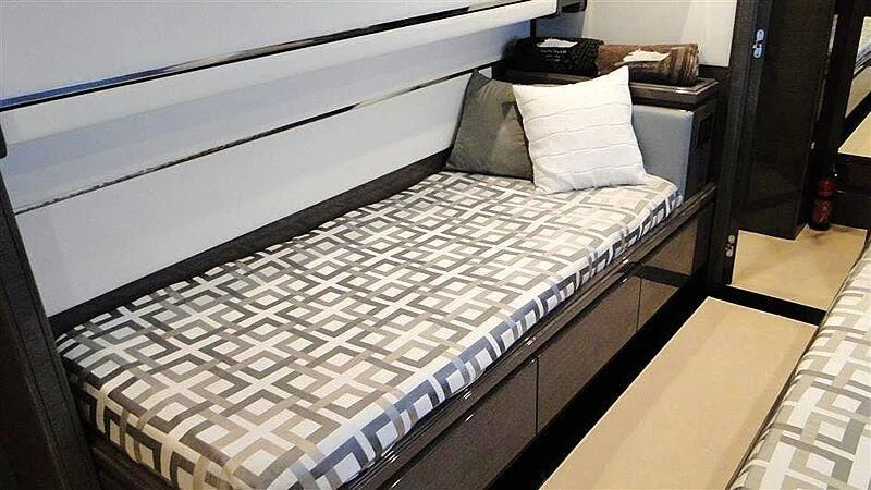 a bed with white sheets aboard PRATA DO LYS Yacht for Sale